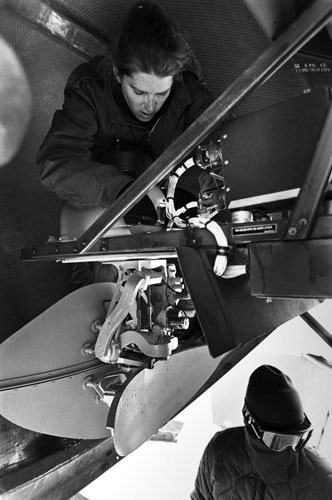 <p>Navy VXE-6 crew changes out a radar unit in the nose of a LC-130 at McMurdo.</p><p>“When we have extremely low temperatures, say 50 below or lower, we start having problems with hydraulic system seals leaking, particularly in the propeller system. In fact 50 below F is our fence. We won’t fly to the pole until the temperatures reach 49.9 and higher. Something else we are particularly concerned about down here is the condition of the landing gear and the ability of the strut system to absorb the shock when we land on skis out here.”<br/>—Naval Officer Gary Iverson</p>