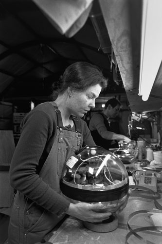 <p>Eva Dahlberg of Sweden seals up an AMANDA Project photo multiplier. Strings of these multipliers will be sunk over a mile into the ice to detect neutrinos passing through the earth.</p><p>"I was finishing a physics degree at Leeds. One of my professors said, ’Why don’t you work for me: We’re involved in cosmic rays at a sheep farm at Leeds or at the South Pole. Every Friday at the pub I said, ’Let me go to the South Pole; I’ve got to go to the South Pole.’ Ever since I came down for the summer I said, ’I want to winter?’ So then he said that I could winter so long as I finish my Ph.D. first. So I finished my Ph.D. and a few weeks later I was flying down to winter over."<br/>—Dr. Simon Hart, U.K.</p>