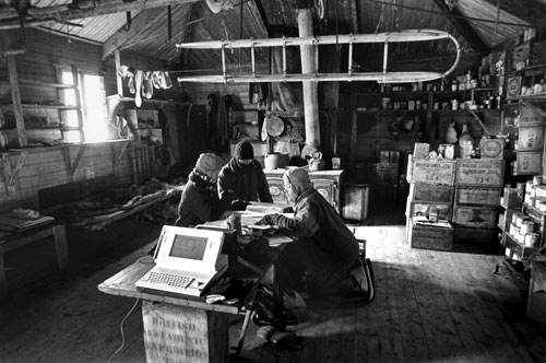 <p>Members of the New Zealand-based Antarctic Heritage Trust discuss the preservation of artifacts in Shackleton’s hut, built at Cape Royds in 1908.</p><p>“In 1949 my father moved us to Oamaru, south of Christchurch. That was where the first news of Scot’s death was sent around the world. This history fired up my interest in Antarctica. We have everything on inventory. Through detailed research of expedition stores lists it’s possible to source material because much has been moved from one building to another by early expedition people themselves.”<br/>—David Harrowfield (right)</p>
