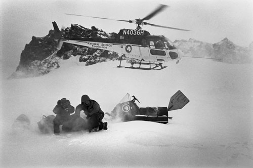 <p>Volcanologists Adam Maciajewski and Kurt Panter land at the Fang Glacier acclimatization camp at 9,400 feet on Mt. Erebus, A three-day stay is required before ascending to the hut at 11,400 feet and the summit.</p><p>"We are driven here by science. Our scientific questions have changed. Now there’s less interest in volcanoes per se and, at least in my mind, more interest in the impact of the volcano on the Antarctic environment. We are looking at the air samples at the South Pole to see if we can find signatures of Erebus gas there. This is my 25 field season, my 24th on Erebus. I just wish there was some young upstart that would push me aside and take the place over. But you get a little bit of territory and it’s ’my little bit of territory.’"<br/>—Dr. Philip Kyle</p>